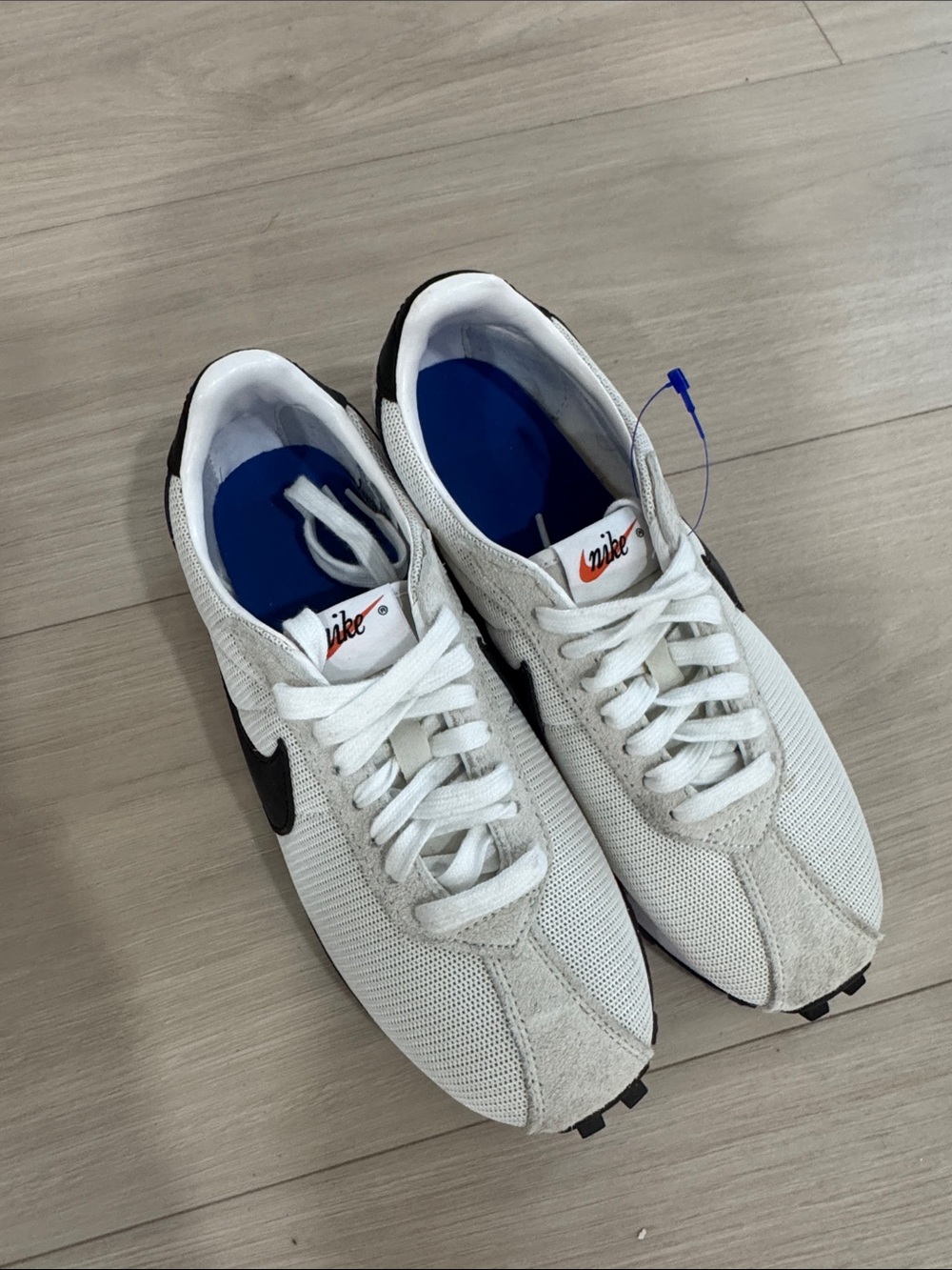 Nike Whitish beige Sneakers with Black Swoosh
